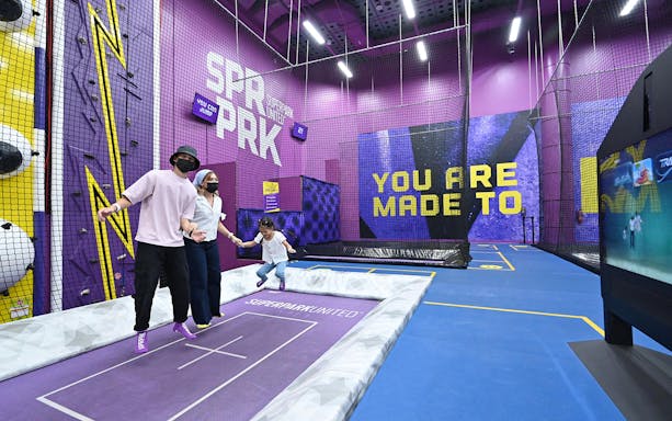 Visitors enjoying trampoline activities at SuperPark Singapore indoor playground.
