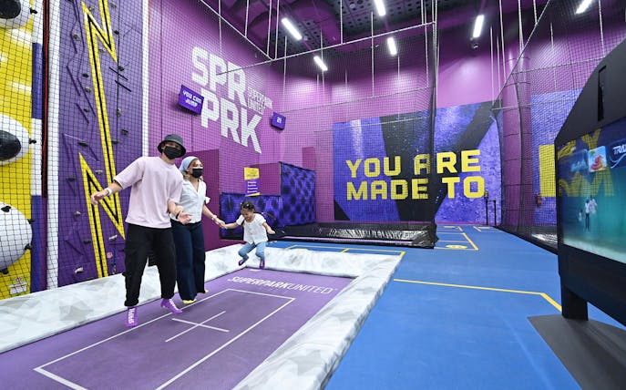 Visitors enjoying trampoline activities at SuperPark Singapore indoor playground.