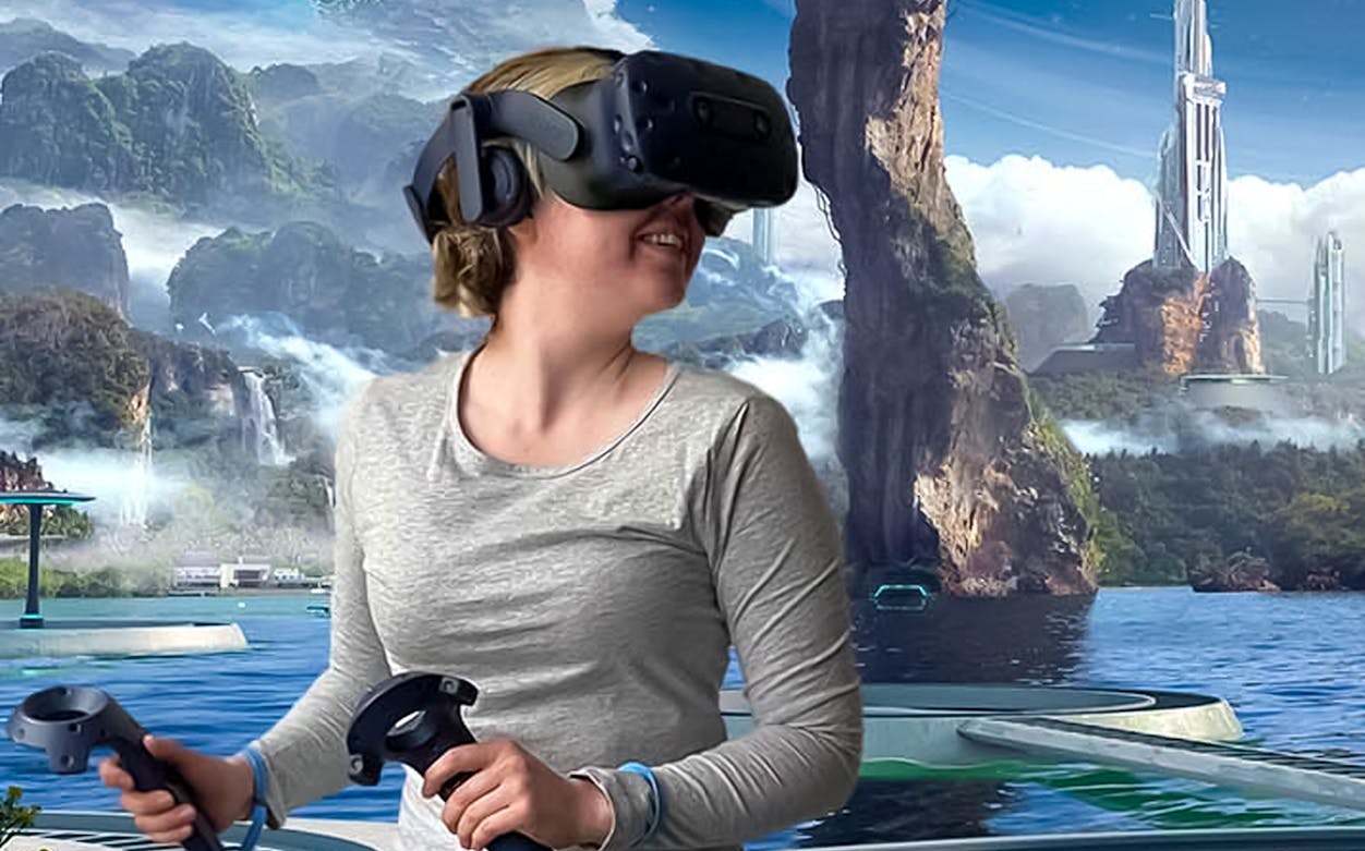 Person enjoying Apsis VR Escape Room experience with futuristic landscape.