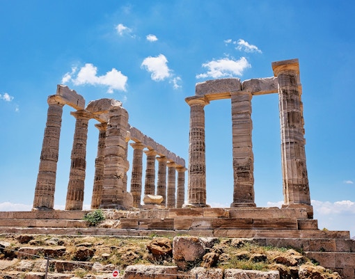 Cape Sounion Temple of Poseidon with small group tour exploring ancient ruins.