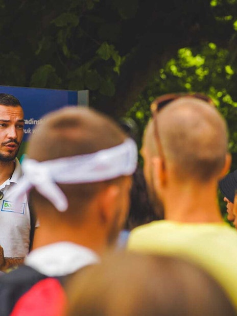 Tour guide explaining Krka National Park map to visitors from Split.