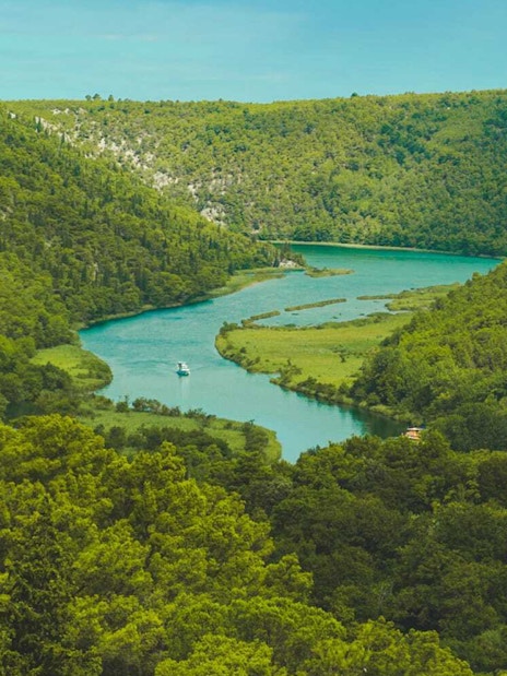 River winding through lush greenery in Krka National Park, Croatia.