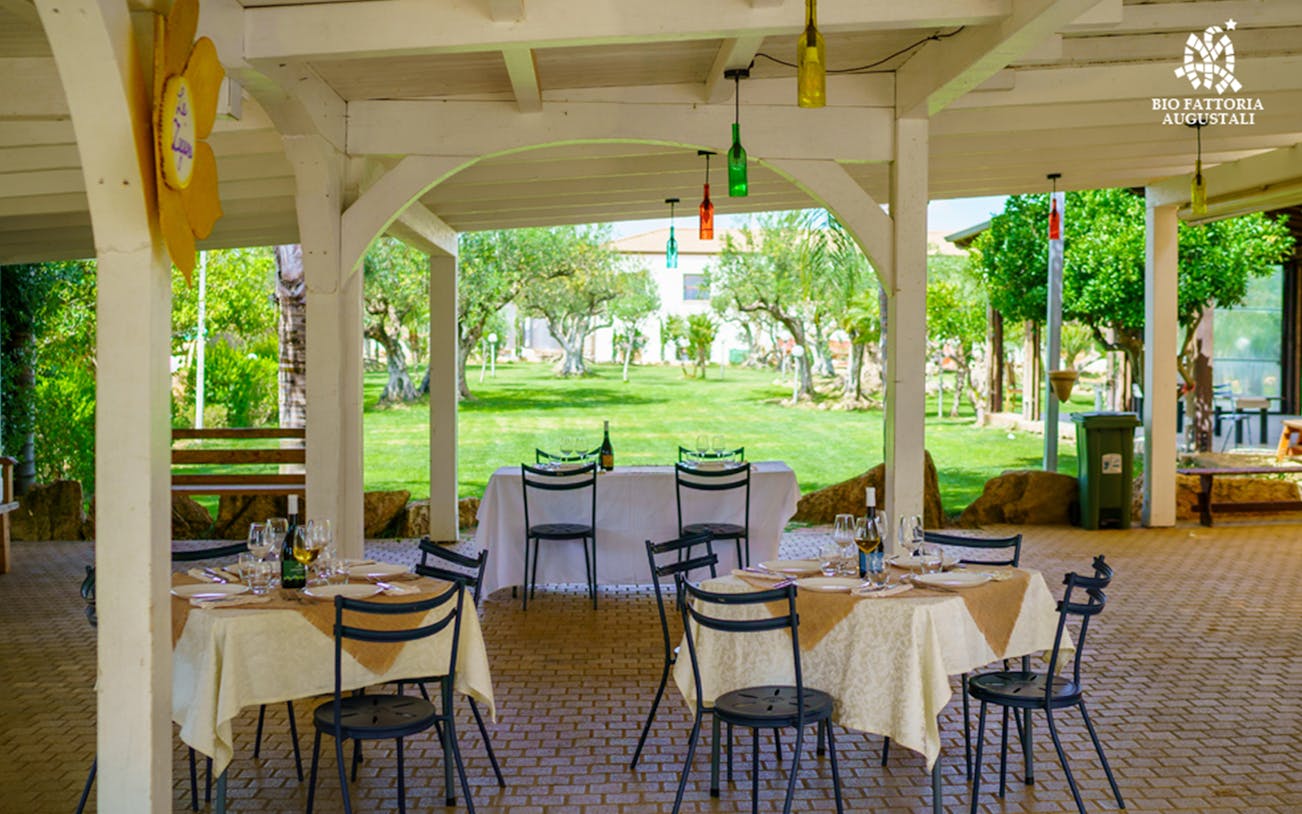 Guests enjoying a Sunday lunch at an organic farm near Rome, Italy.