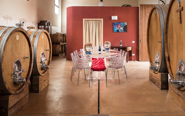 Guests enjoying a meal at an organic farm in Rome, Italy, during a Sunday lunch tour.