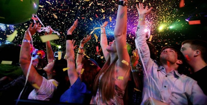 Partygoers celebrating New Year's Eve with confetti at Colette in Soho.