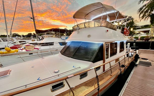 Yacht docked at sunset for Southern Islands Yacht Guided Tour 2.5 hours.
