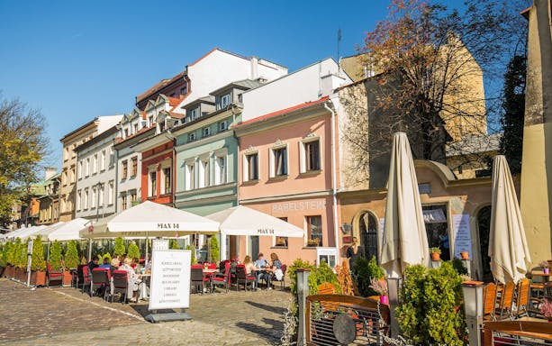 Outdoor cafes and colorful buildings in Kazimierz, Krakow's Jewish Quarter.