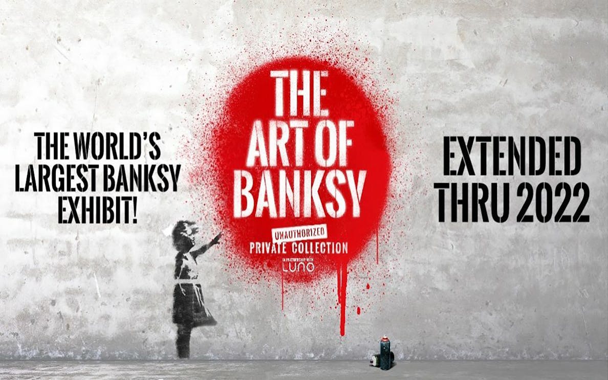The Art of Banksy exhibit poster with red spray paint and girl stencil.