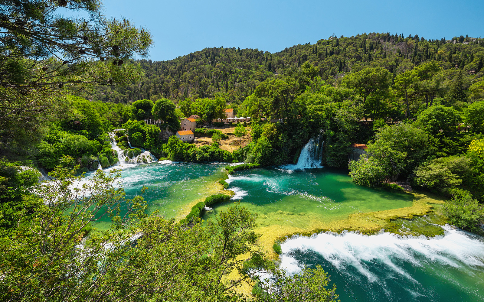 Krka National Park waterfalls with tourists swimming, Split wine tasting tour.