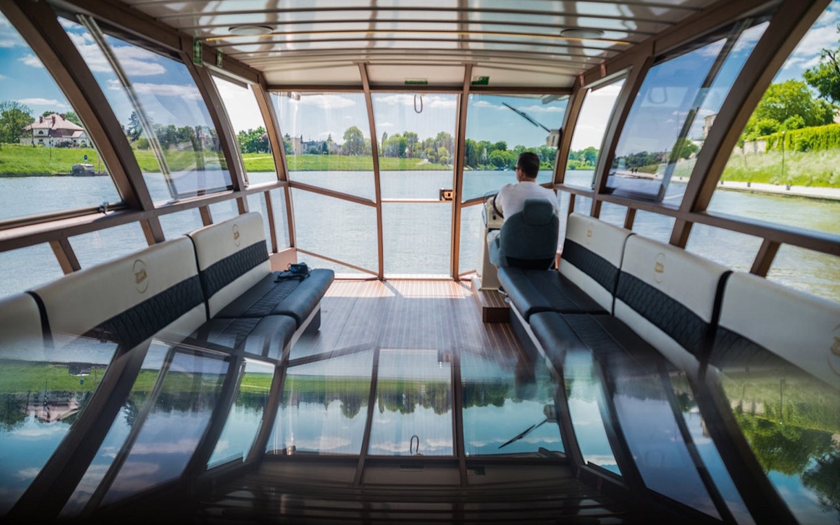 Interior view of a boat on the Vistula River during a Krakow guided tour.