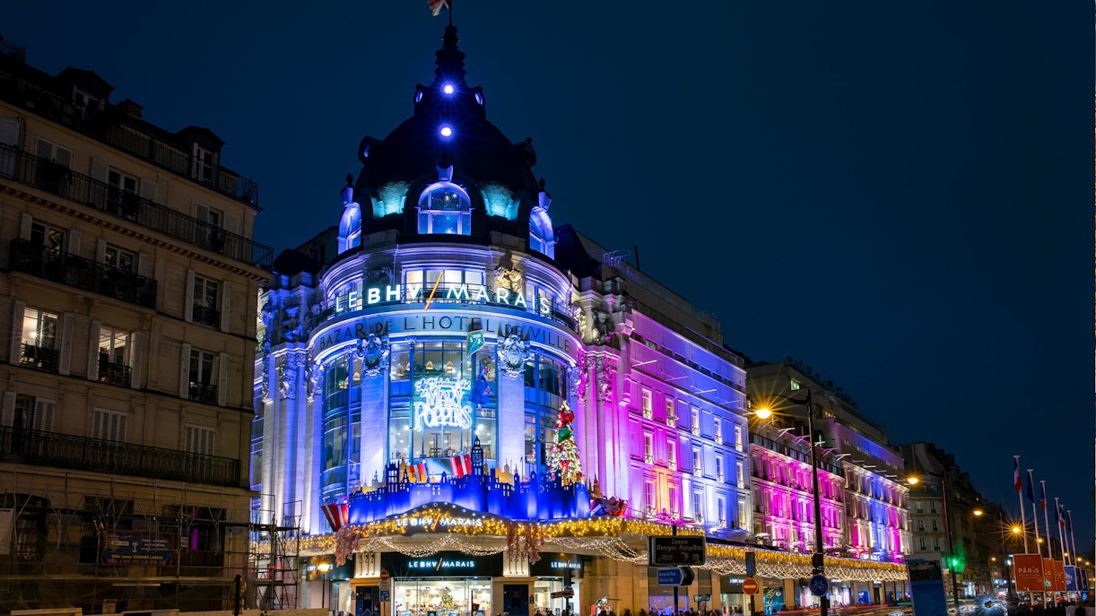 Le BHV Marais department store illuminated at night during Le Marais Walking Tour, Paris.
