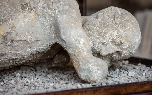 Plaster cast of a Pompeii victim preserved in volcanic ash, Italy.