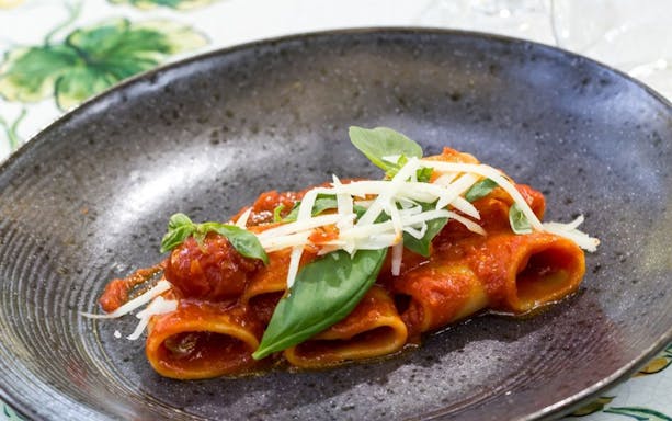 Pasta dish with tomato sauce and basil, Pompei tour from Rome.