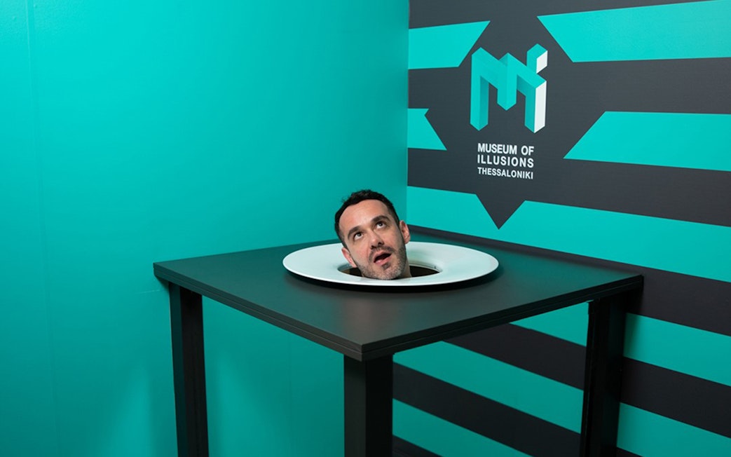 Head illusion exhibit at Museum of Illusions Thessaloniki.