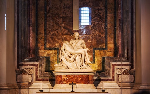 Pietà sculpture inside St. Peter's Basilica, Vatican City, featured on guided tour.
