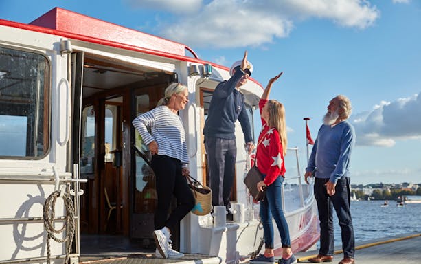 Tourists boarding a boat for Alster round trip in Hamburg.