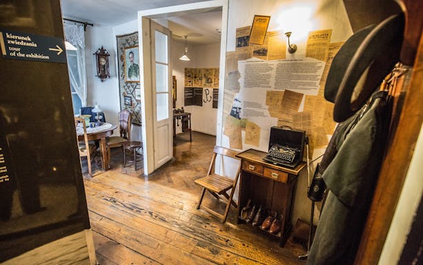 Interior of a historical room with typewriter and documents, part of Plaszow concentration camp tour.