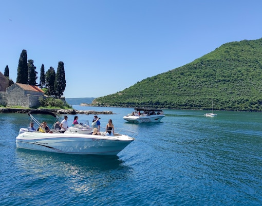 Our Lady of the Rocks island with church, Kotor Bay, speedboat tour in Montenegro.
