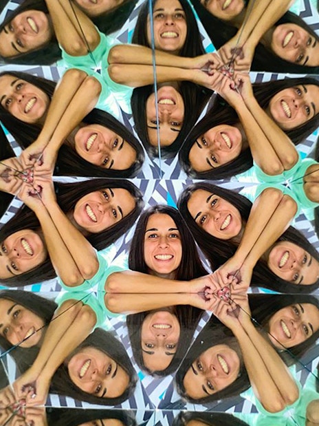 Person reflected multiple times in mirrors at Museum of Illusions, Thessaloniki.