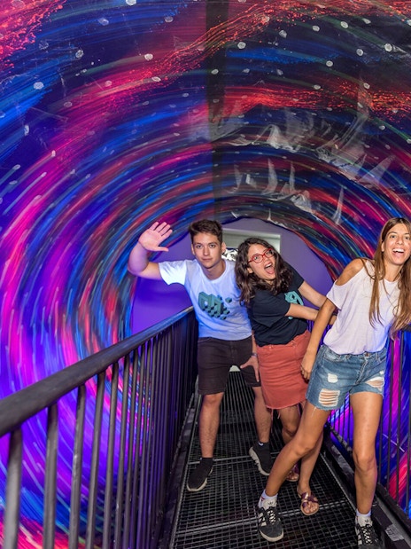 Visitors enjoying the vortex tunnel at Museum of Illusions, Thessaloniki.