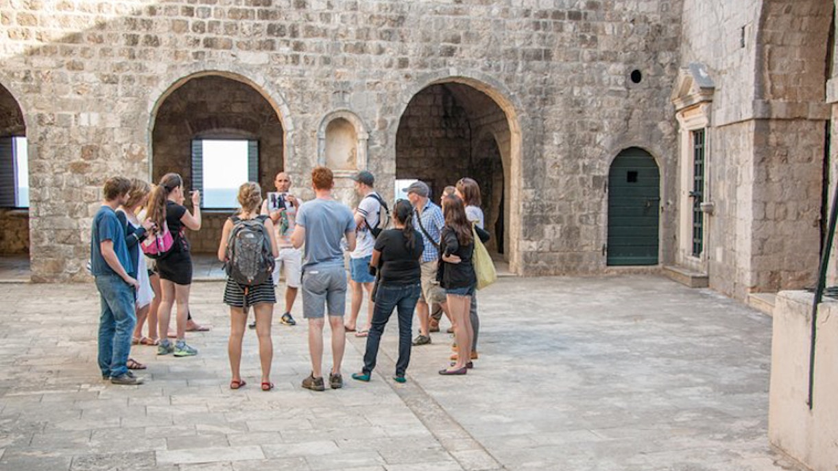 Tour group exploring Dubrovnik's historic walls on a Game of Thrones tour.