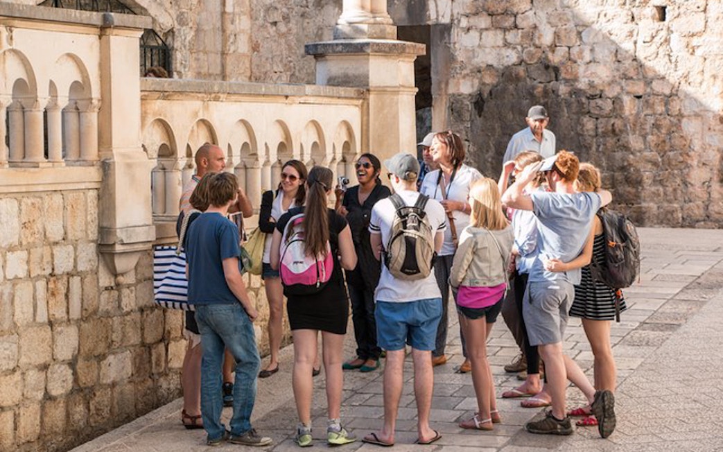 Tour group exploring Dubrovnik's historic walls on Game of Thrones tour.
