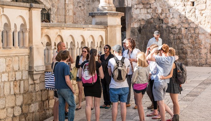 Tour group exploring Dubrovnik's historic walls on Game of Thrones tour.