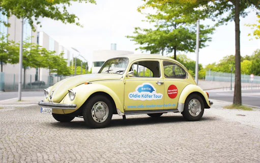 VW Käfer Cabrio parked on a Berlin street for Oldie Käfer Tour.