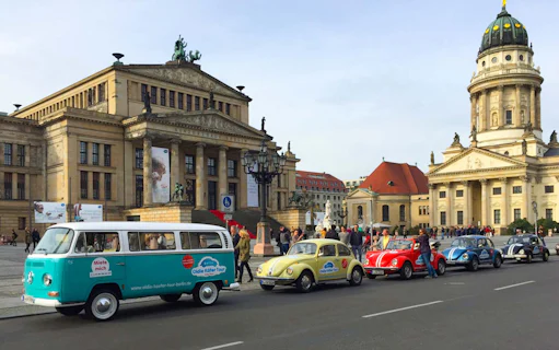 VW Käfer Cabrio tour cars in front of Konzerthaus Berlin, Germany.