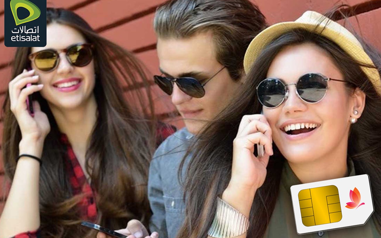 Tourists using phones with Etisalat SIM cards at Abu Dhabi Airport.