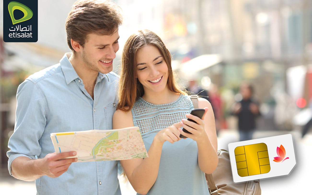 Tourists using Etisalat SIM card at Abu Dhabi Airport for 5G/4G connectivity.