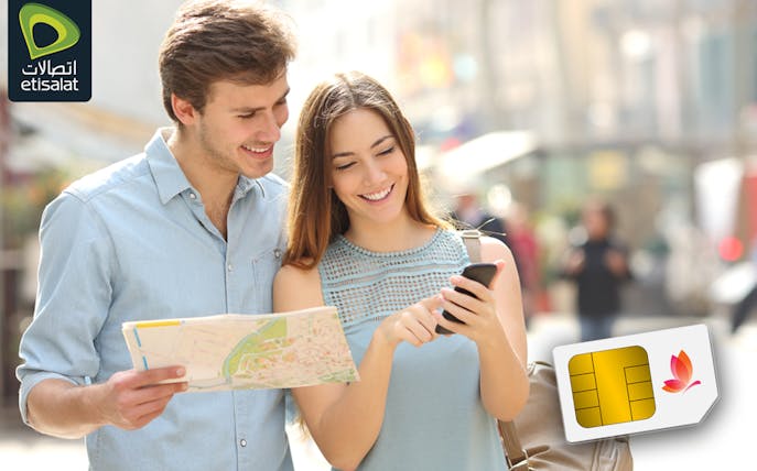 Tourists using Etisalat SIM card at Abu Dhabi Airport for 5G/4G connectivity.