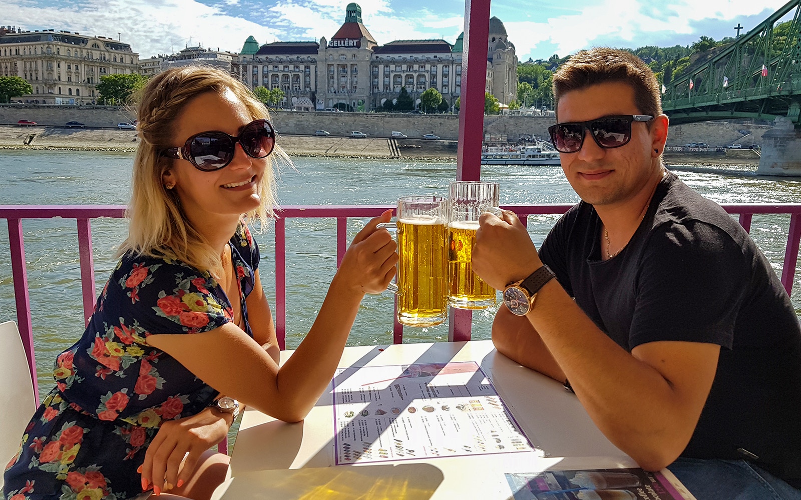 Budapest river cruise with partygoers enjoying unlimited drinks on a boat.