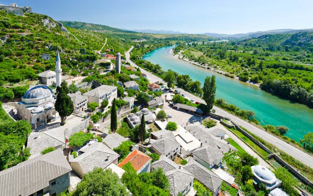 Aerial view of Mostar with Neretva River and historic buildings, Bosnia and Herzegovina.