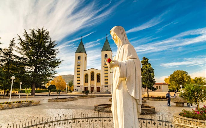 Statue of Virgin Mary in front of St. James Church, Medjugorje, Bosnia and Herzegovina.