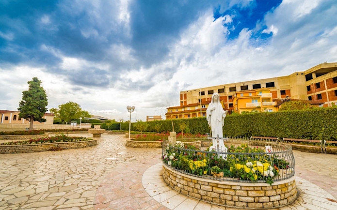 Statue of Virgin Mary in Medjugorje garden, Bosnia and Herzegovina, on Mostar & Medjugorje Day Trip.