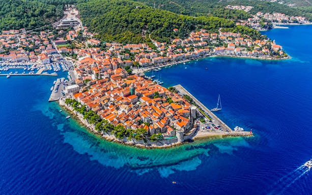 Aerial view of Korcula Island with historic buildings and marina, Croatia.