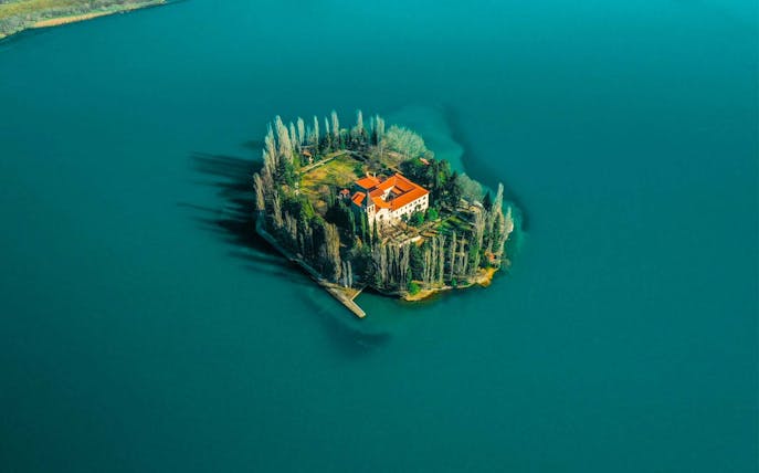 Island monastery surrounded by water in Krka National Park, Croatia.