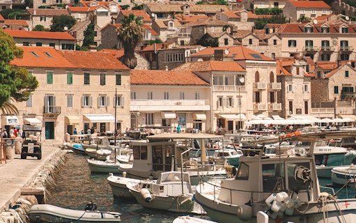 Boats docked at a harbor in a coastal town, part of the Blue Lagoon half-day tour.