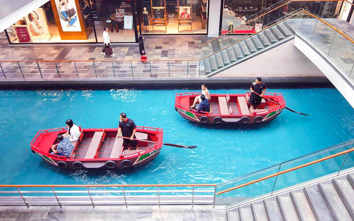 Sampan boats on indoor canal at Marina Bay Sands, Singapore.