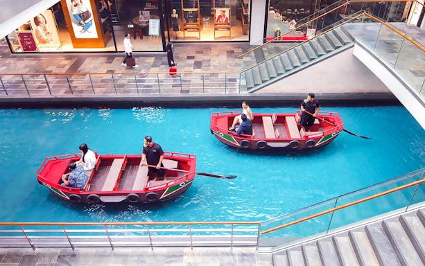Sampan boats on indoor canal at Marina Bay Sands, Singapore.