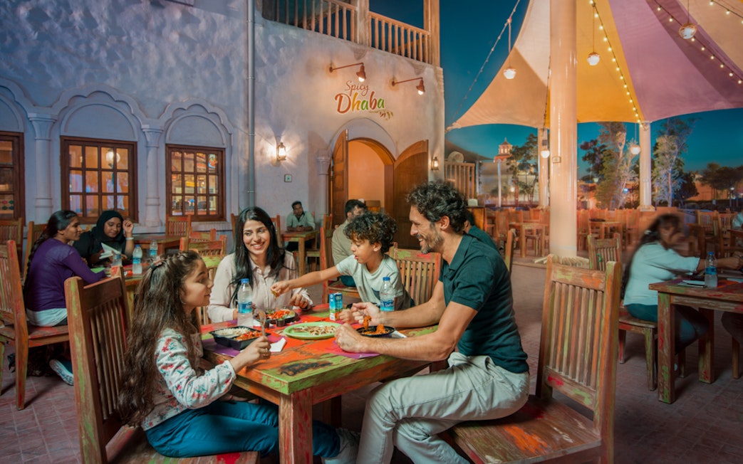 Family dining at Spicy Dhaba in Bollywood Parks, Dubai.