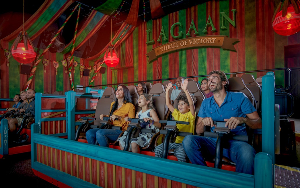 Visitors enjoying a ride at Bollywood Parks™ Dubai's Lagaan attraction.