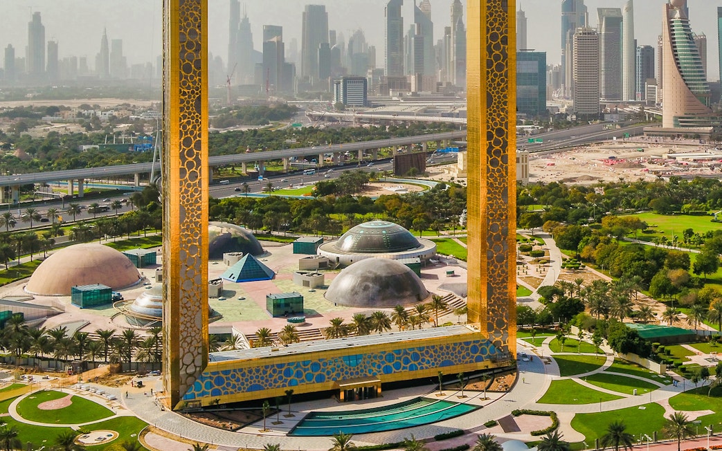 Dubai Frame with city skyline in the background, part of Combo: BOLLYWOOD PARKS™ + Dubai Aquarium & Underwater Zoo tour.