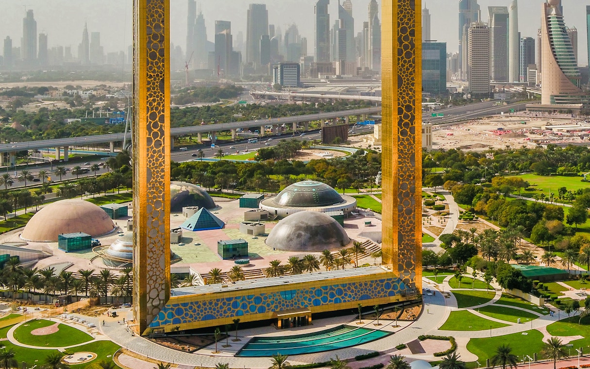 Dubai Frame with city skyline in the background, part of Combo: BOLLYWOOD PARKS™ + Dubai Aquarium & Underwater Zoo tour.