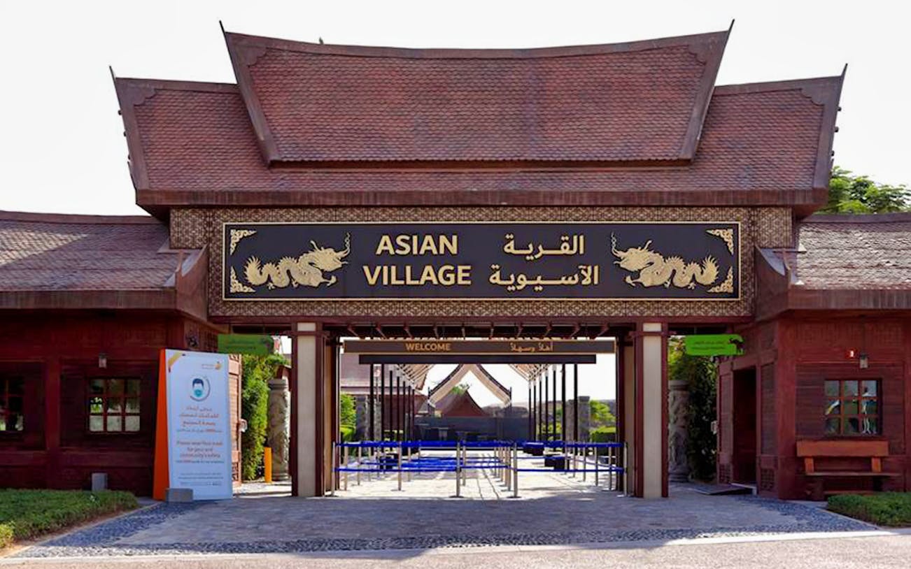 Entrance to Asian Village at Dubai Safari Park, featuring traditional architecture and dragon motifs.