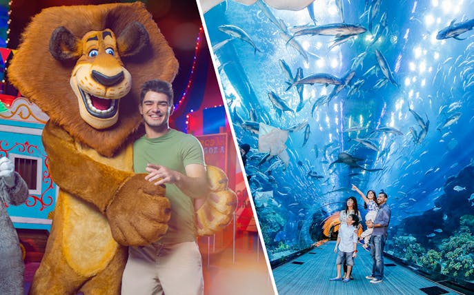 MOTIONGATE™ Dubai character with visitor; family exploring Dubai Aquarium tunnel with marine life.