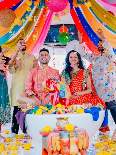 Group celebrating with colorful decorations at Ain Dubai, part of Combo: MOTIONGATE™ Dubai + Ain Dubai Tickets.