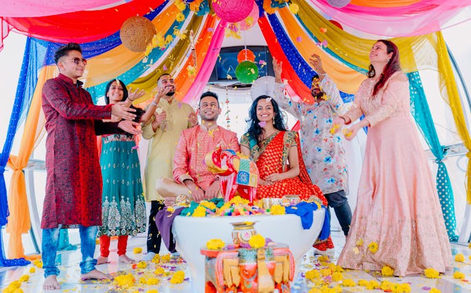 Group celebrating with colorful decorations at Ain Dubai, part of Combo: MOTIONGATE™ Dubai + Ain Dubai Tickets.