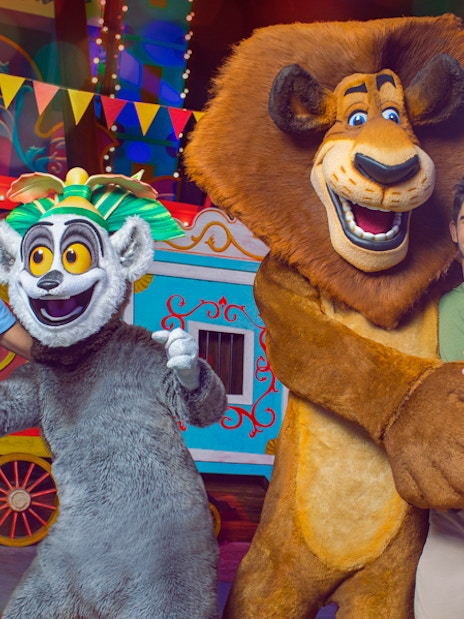 Visitors posing with animated characters at MOTIONGATE™ Dubai.